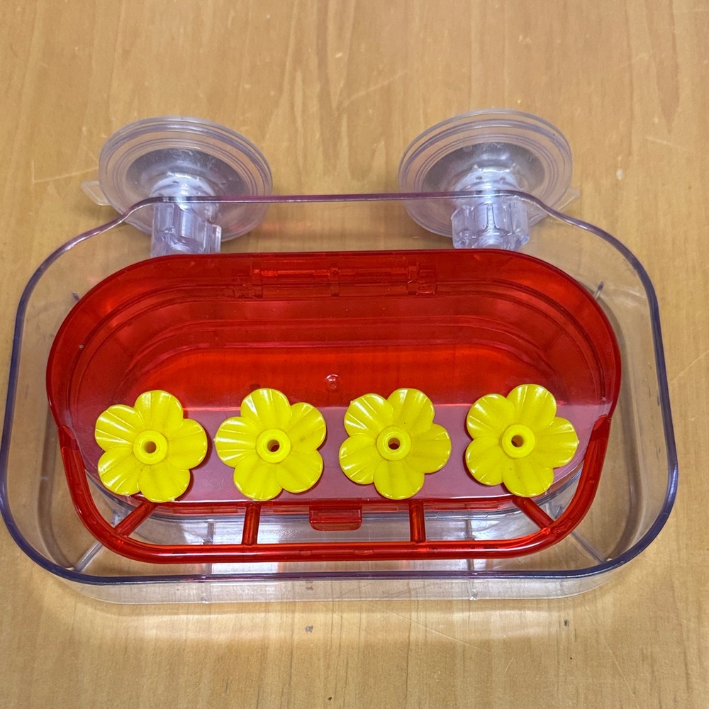 Vibrant Red and Yellow Flower Suction Toy